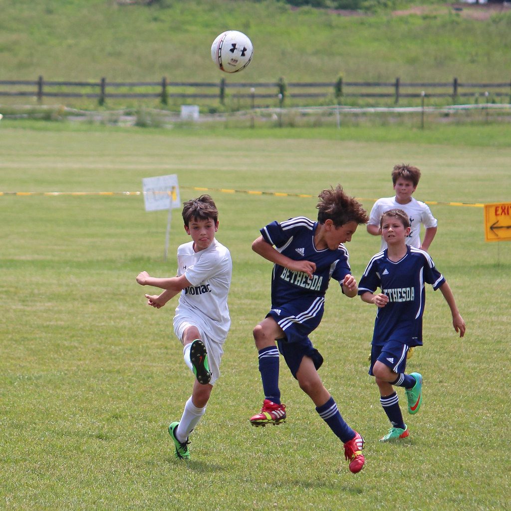Teenagers competing in a soccer match